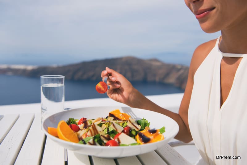 woman eating organic food during travel