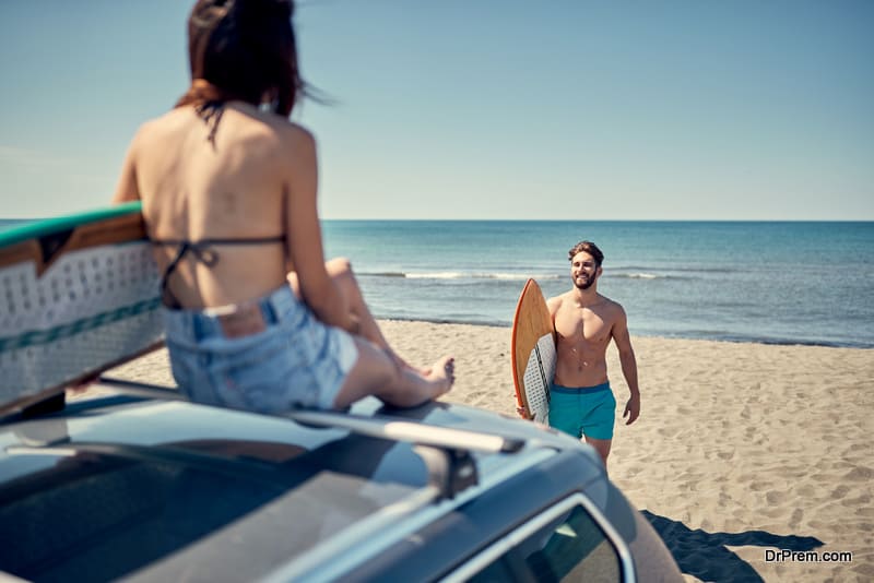 sexy woman on the beach ready for surfing