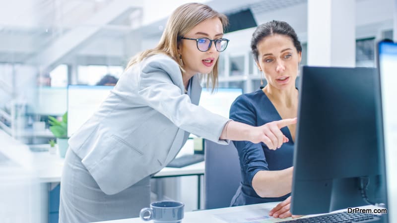 In the Busy Corporate Office Female Manager Explains Task to Businesswoman