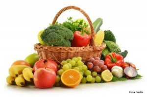 Composition with vegetables and fruits in wicker basket