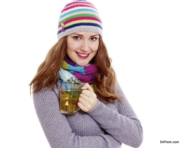 Smiling girl with cup of tea