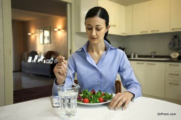 Woman eating salad