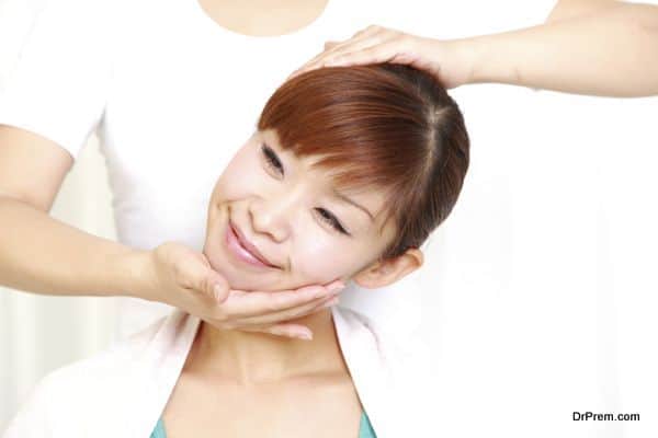 young japanese woman getting chiropractic