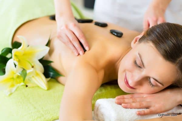 woman having wellness hot stone massage