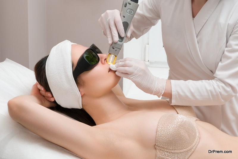 The procedure for removing hair on the body of a woman in a cosmetology clinic. Laser hair removal