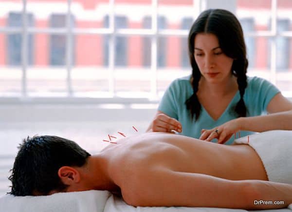 Acupuncturist with patient