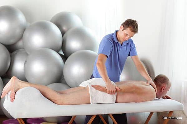 physiotherapist working with pateint's arm