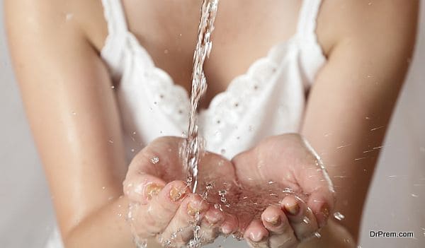 young girl washes with clean water