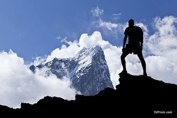 Young woman hiker hiking in Himalaya Mountains in Nepal