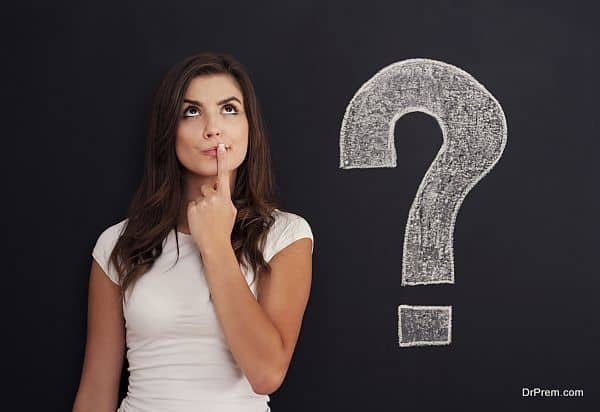 Woman with question mark on blackboard