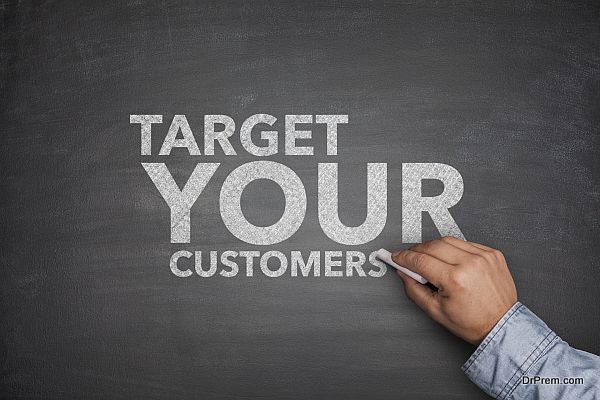 Target your customers on black Blackboard with hand