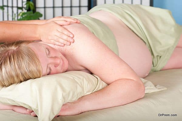 Blonde Woman Receives Prenatal Massage