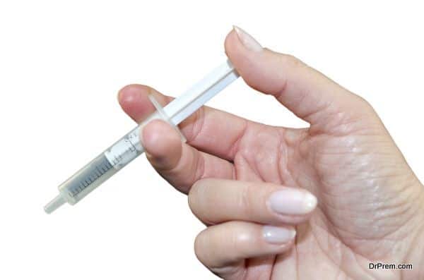 Human hand with syringe