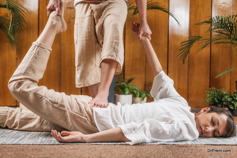 Thai Yoga Massage. Passive Half locust stretches, quadriceps, and psoas muscles
