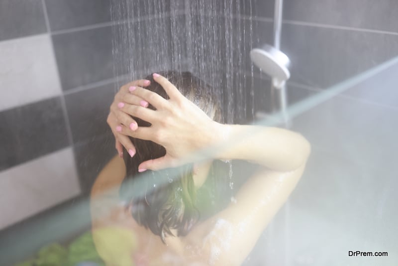 Woman takes hot shower in bathroom. Power and benefits of contrast shower concept