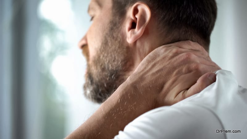 Middle-aged man feeling neck pain