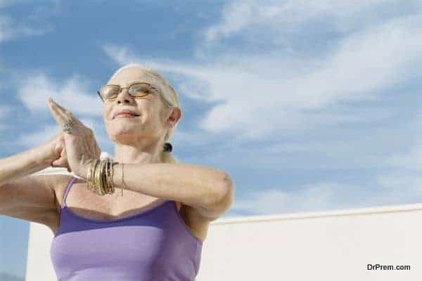 Senior woman in yoga or tai chi pose