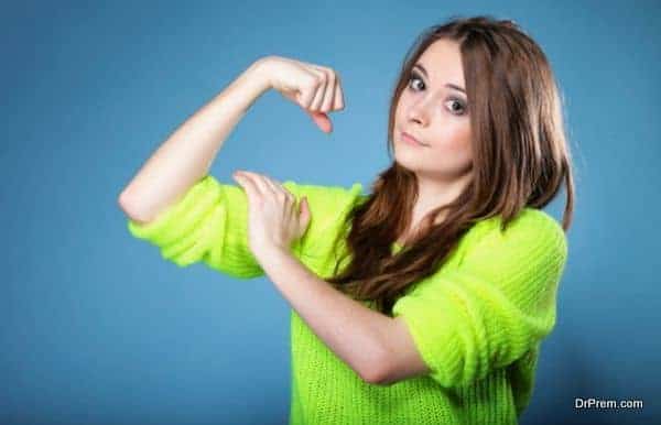 Girl shows her muscles strength and power