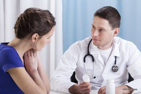 Young doctor recommending medicines to female patient
