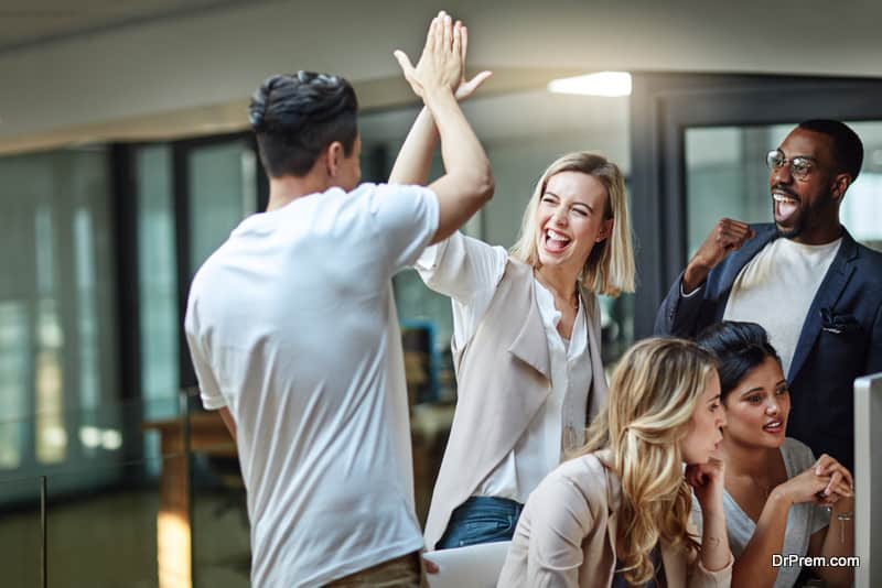 group-of-colleagues-giving-each-other-a-high-five