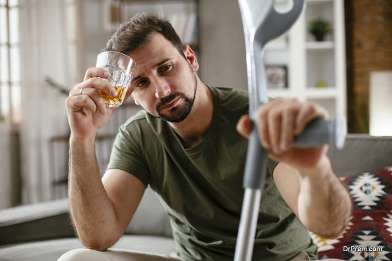 Depression man drinking alcohol at home