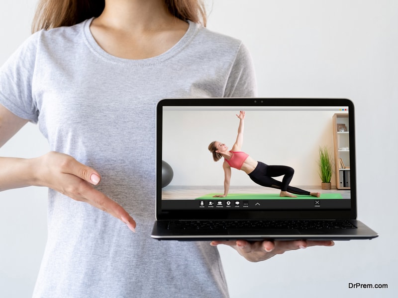 watching yoga on laptop 