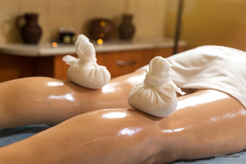 Woman enjoying a Ayurveda oil massage treatment in a spa