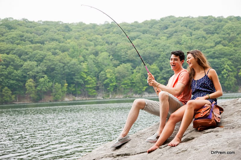 Young couple fishing at lake