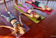 Yoga class lying in savasana pose