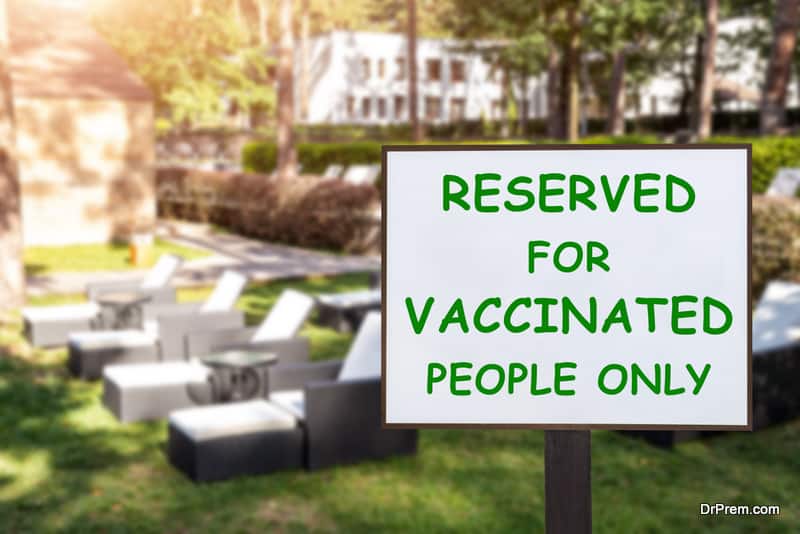 Text plate RESERVED FOR VACCINATED PEOPLE ONLY at luxury hotel pool