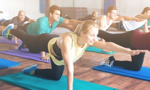 adults-having-yoga-class-in-sport-club