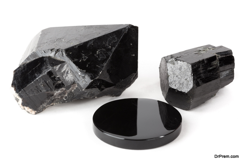 Three black stones black quartz crystal, black tourmaline crystal and black obsidian mirror