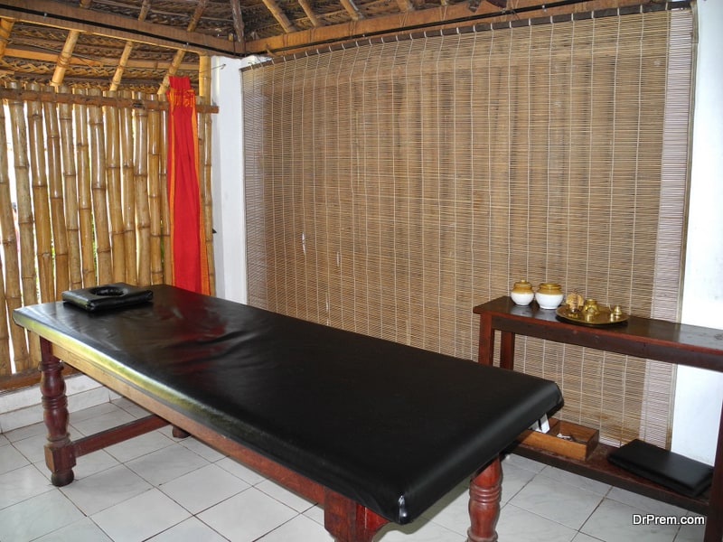 Ayurvedic massage table in treatment room