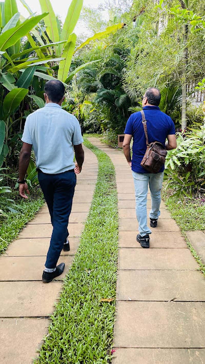 Dr prem at Niraamaya Wellness Retreat with the Niraamaya staff member