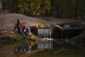 Is Italy the Next Global Longevity Hub? Dr Prem’s Insights into The Mediterranean’s Wellness Reawakening. 10 Is Italy the Next Global Longevity Hub? Dr Prem’s Insights into The Mediterranean’s Wellness Reawakening. full shot man sitting by river