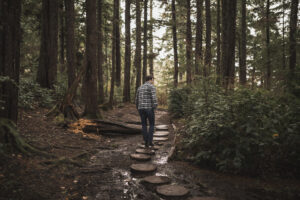 Why 7 Days in Nature Can Reset Well-Being, Immunity, and Human Performance 6 Why 7 Days in Nature Can Reset Well-Being, Immunity, and Human Performance man walking forest