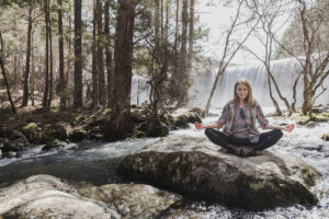 Why 7 Days in Nature Can Reset Well-Being, Immunity, and Human Performance 5 Why 7 Days in Nature Can Reset Well-Being, Immunity, and Human Performance relaxed woman practicing yoga outdoors