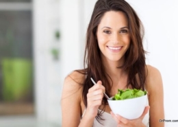 Young woman eating healthy salad