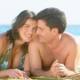 Couple-enjoying-on-beach-600x330