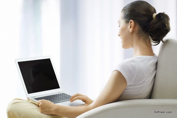 Girl working on computer in light room