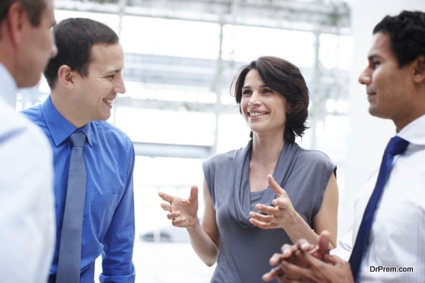 Group of colleagues having a casual chat in the office