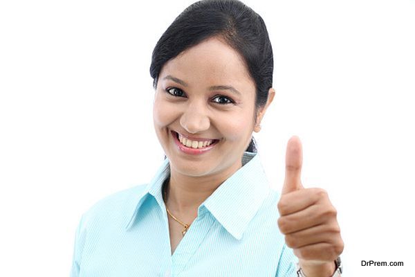 Young business woman with thumbs up gesture