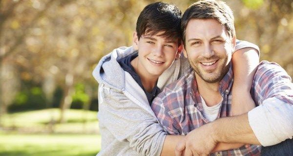 Portrait Of Father And Son In Countryside