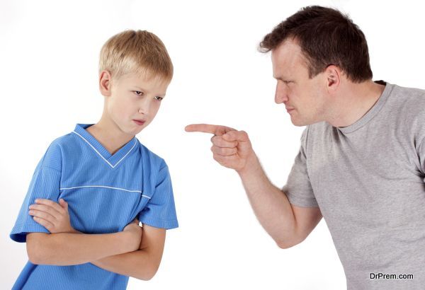 Strict father punishes his son. Isolated on white background