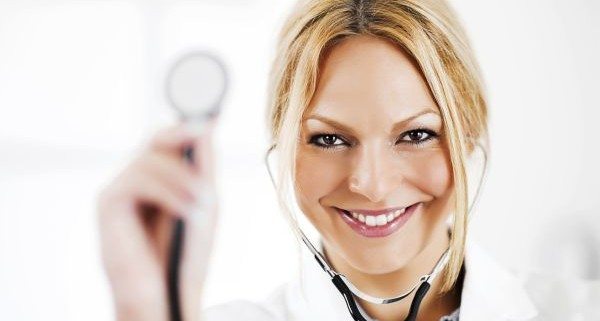 Portrait of successful doctor showing her stethoscope.