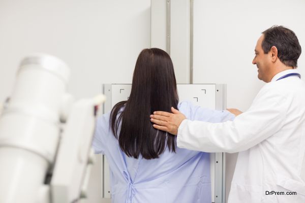 Doctor proceeding a mammography on a patient