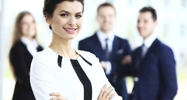Face of beautiful woman on the background of business people
