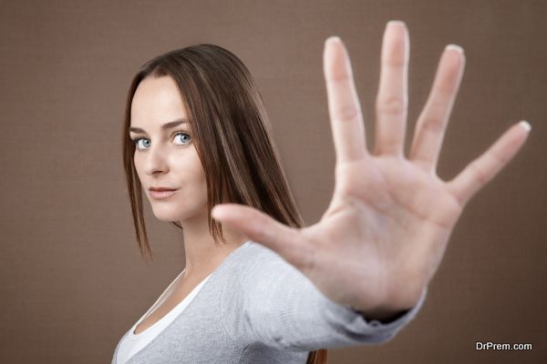 Woman giving hand stop sign