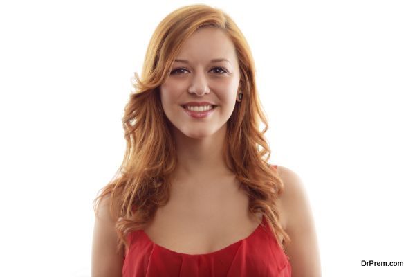 Portrait of young cheerful smiling woman, over white background