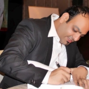 Dr Prem Signing a book